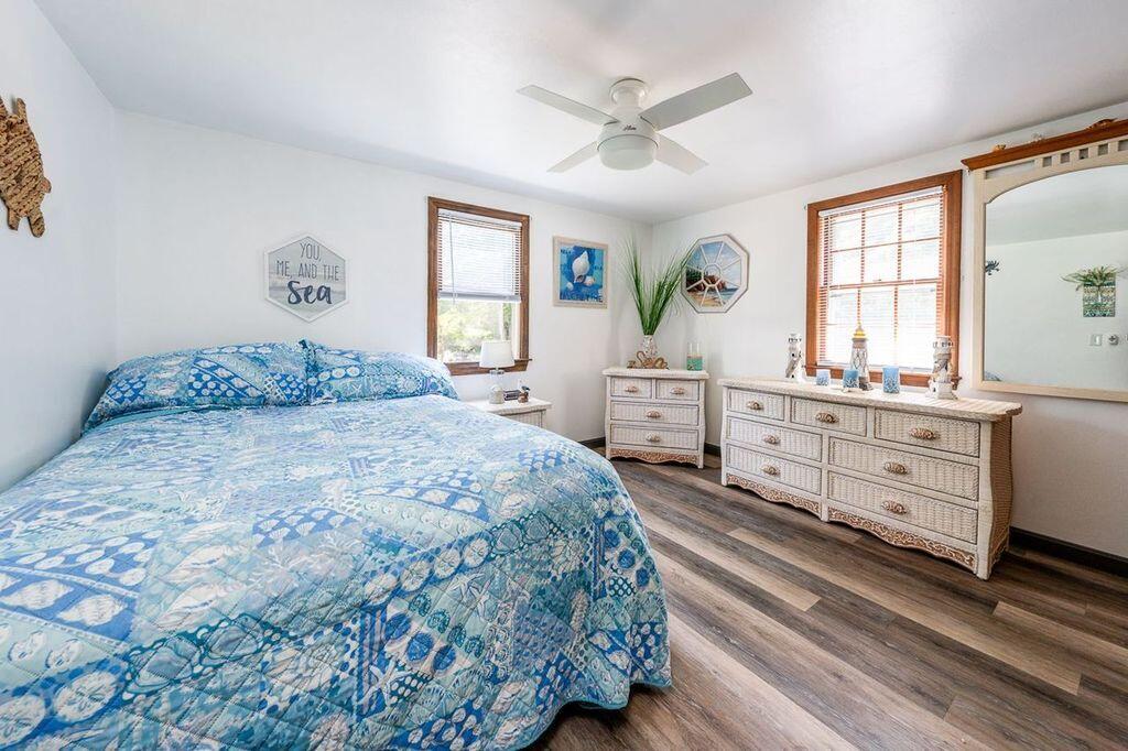 106 Old Great Neck Road Mashpee, MA 02649 - Photo 7 of 21 a bedroom with a bed and a dresser