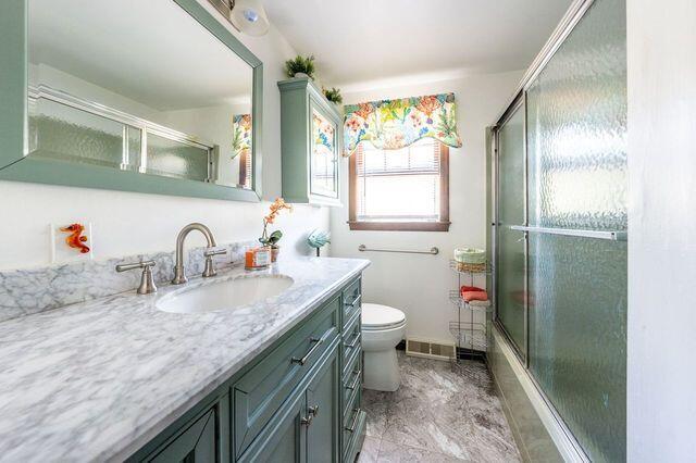106 Old Great Neck Road Mashpee, MA 02649 - Photo 9 of 21 a bathroom with a granite countertop sink and a mirror