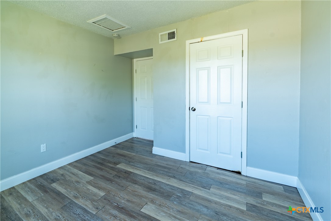 512 Sunset Lane, Unit AD Copperas Cove, TX 76522 - Photo 12 of 23 a view of an empty room with wooden floor