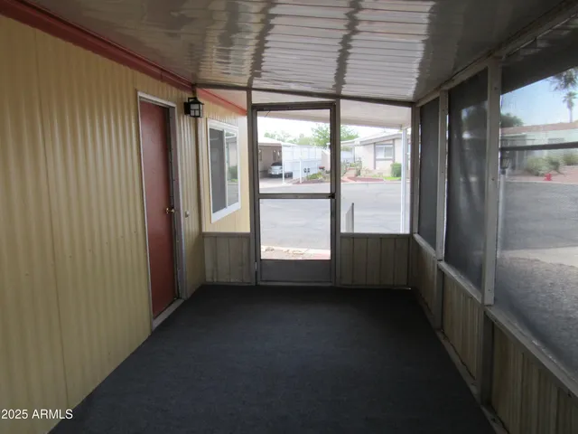 a view of a backyard house and swimming pool