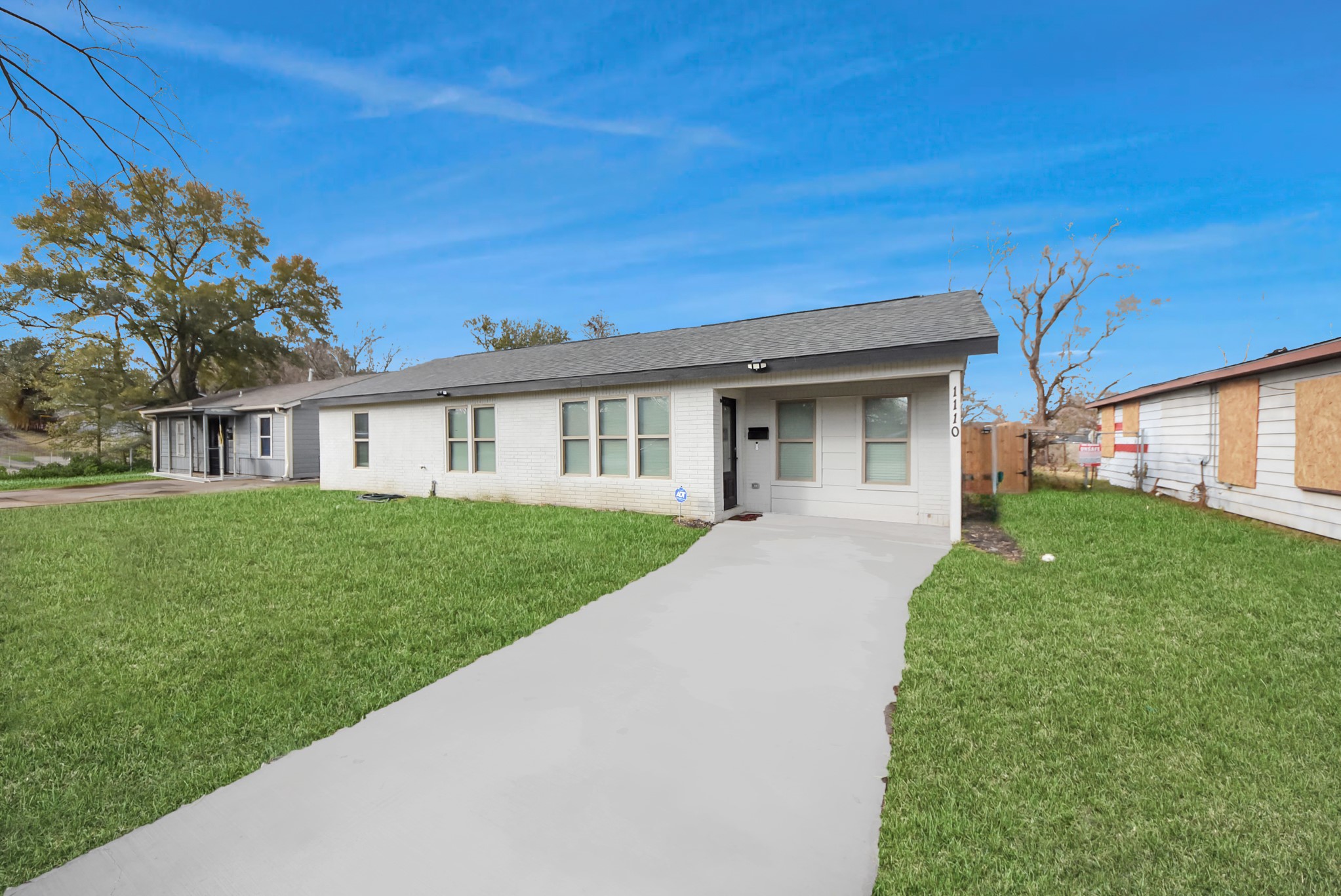 1110 Johnson Street Pasadena, TX 77506 - Photo 3 of 36 a front view of a house with a yard