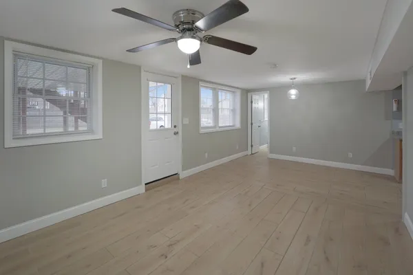 a view of an empty room with a window