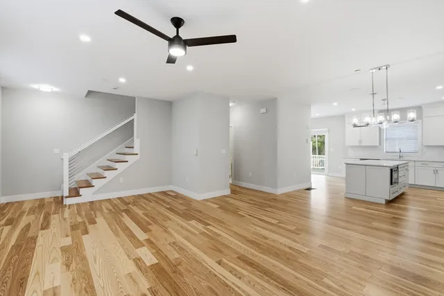 a view of kitchen and hall with wooden floor
