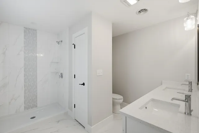 a bathroom with a sink and shower