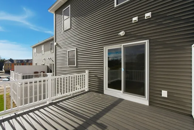 a view of a balcony with wooden floor