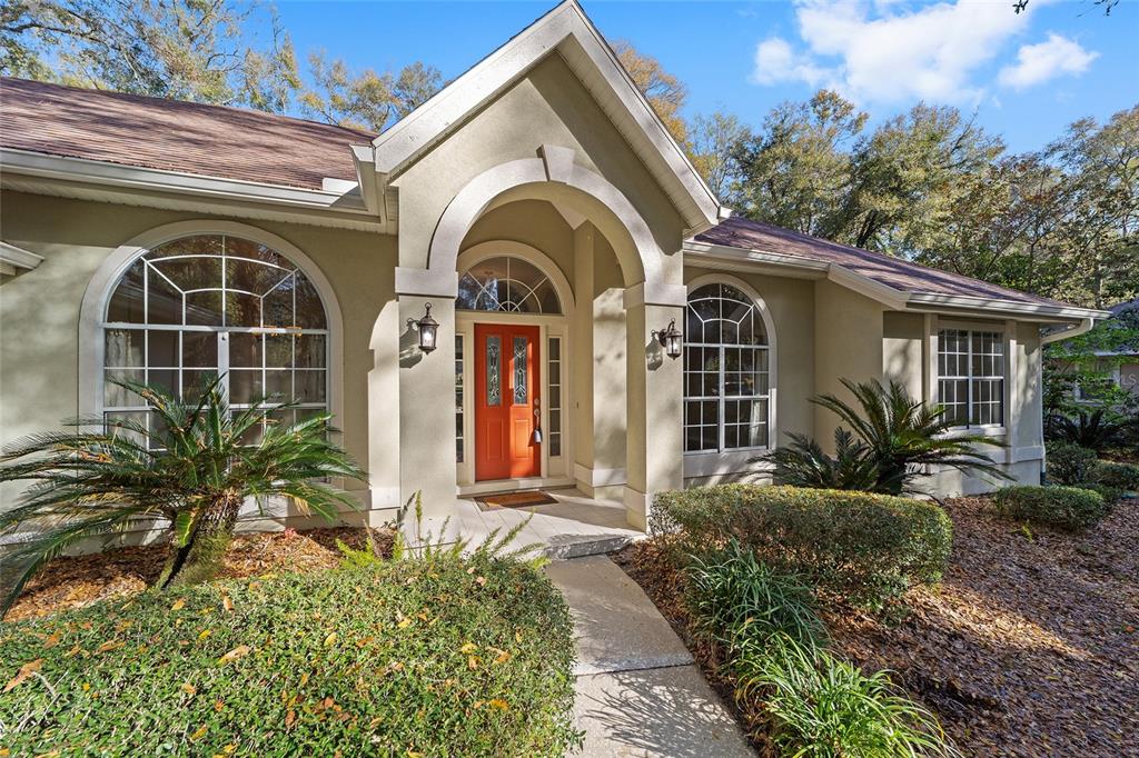 9624 Southwest 54th Road Gainesville, FL 32608 - Photo 1 of 1 a front view of a house with garden