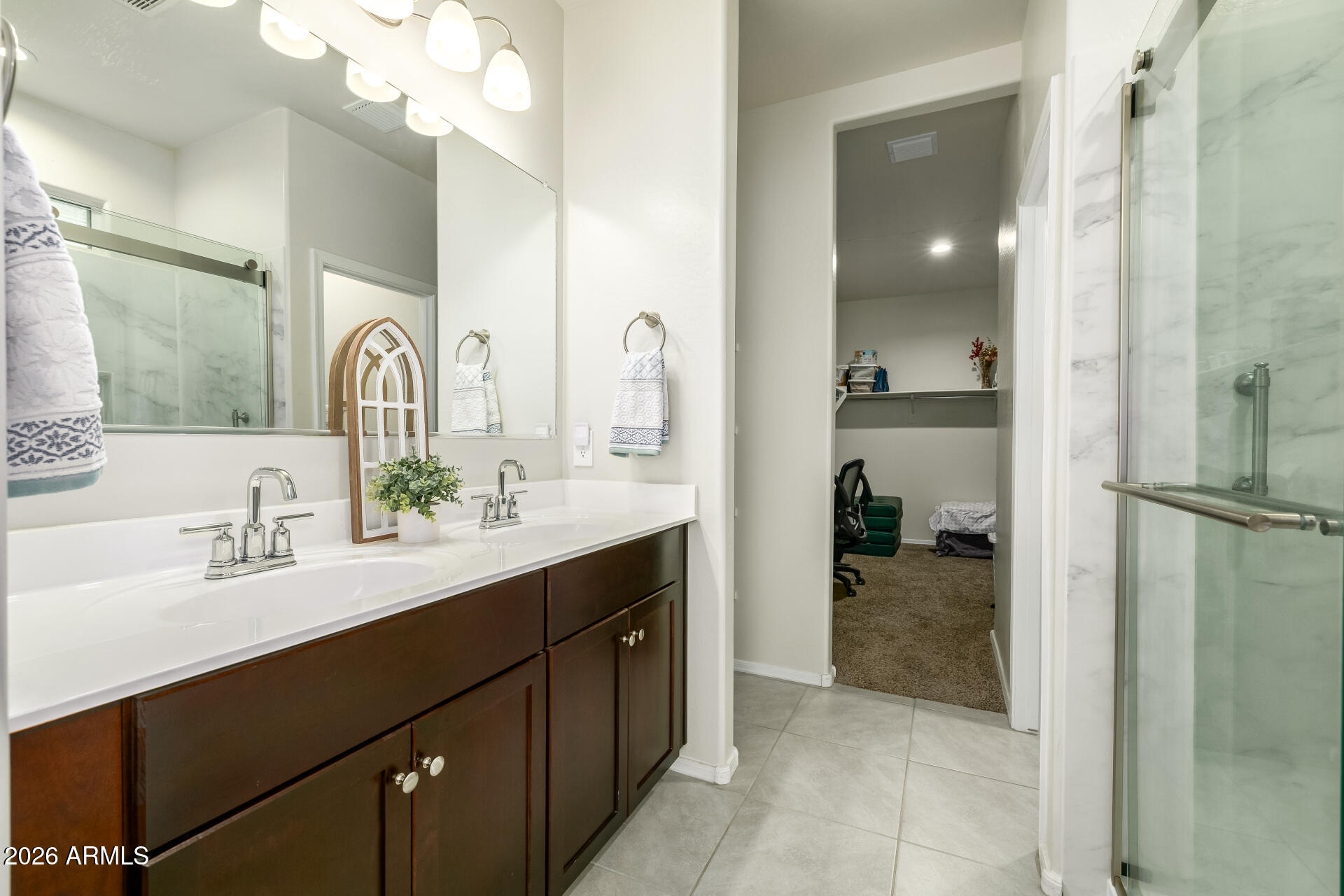 9471 Greenhouse Road Florence, AZ 85132 - Photo 12 of 22 a en suite bathroom with a double vanity sink mirror and shower