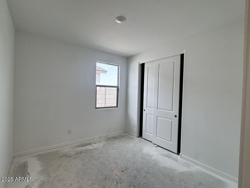 15793 West Beryl Avenue Waddell, AZ 85355 - Photo 11 of 34 an empty room with windows and closet