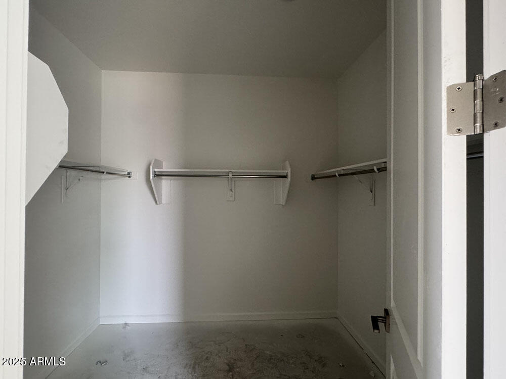 15793 West Beryl Avenue Waddell, AZ 85355 - Photo 13 of 34 a view of a room with racks on the wall