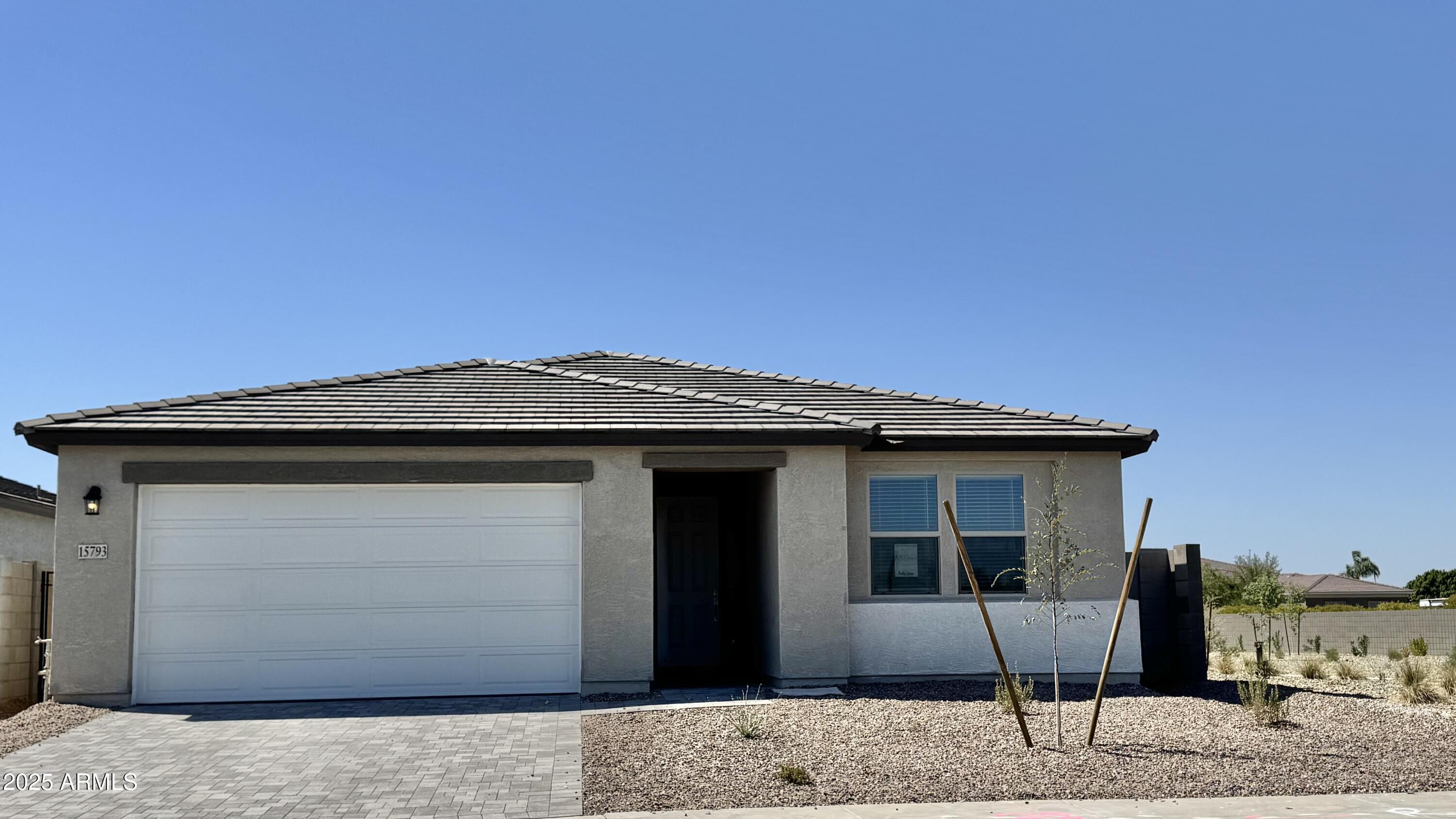 15793 West Beryl Avenue Waddell, AZ 85355 - Photo 2 of 34 a front view of a house with a garage
