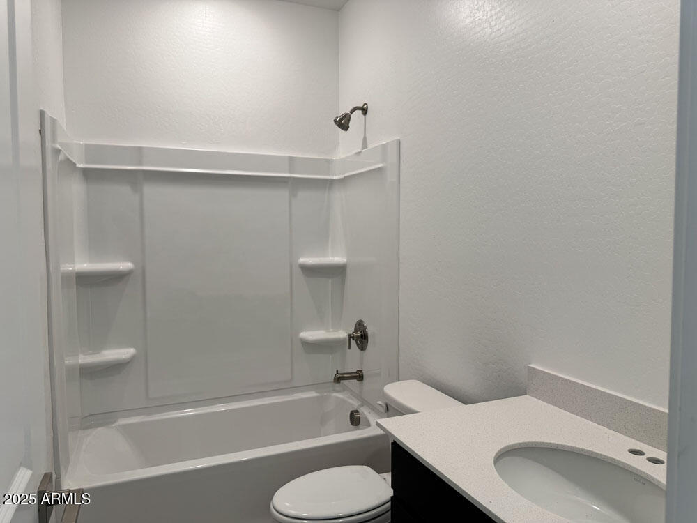 15793 West Beryl Avenue Waddell, AZ 85355 - Photo 5 of 34 a bathroom with a sink toilet and bathtub