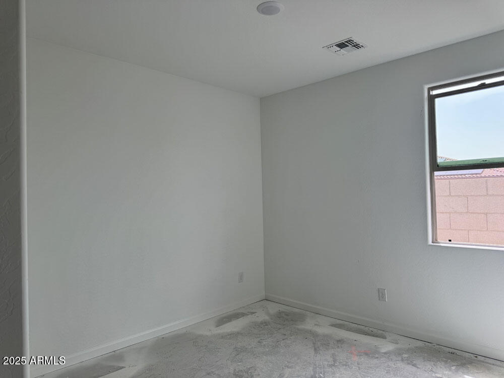 15793 West Beryl Avenue Waddell, AZ 85355 - Photo 6 of 34 an empty room with windows