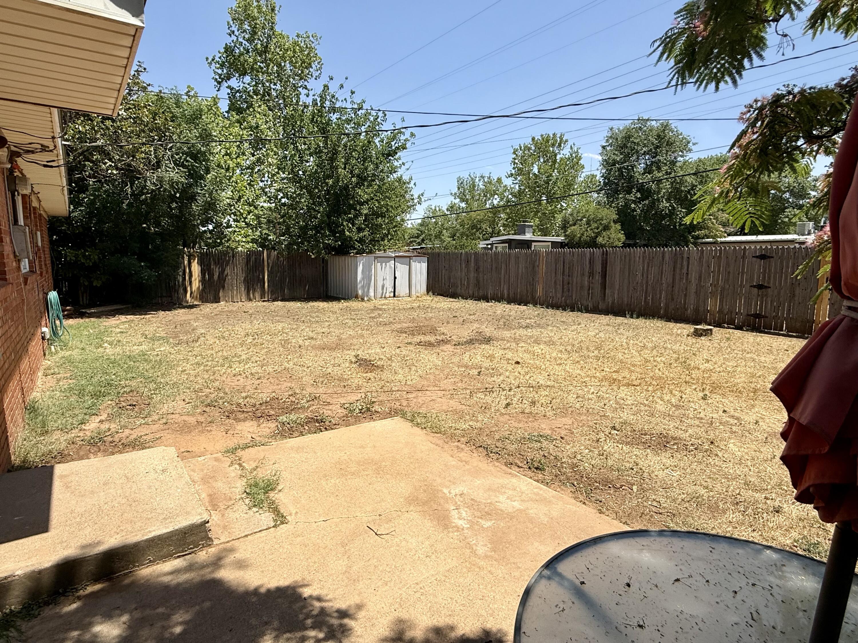 2817 63rd Street Lubbock, TX 79413 - Photo 15 of 16 a swimming pool with yard