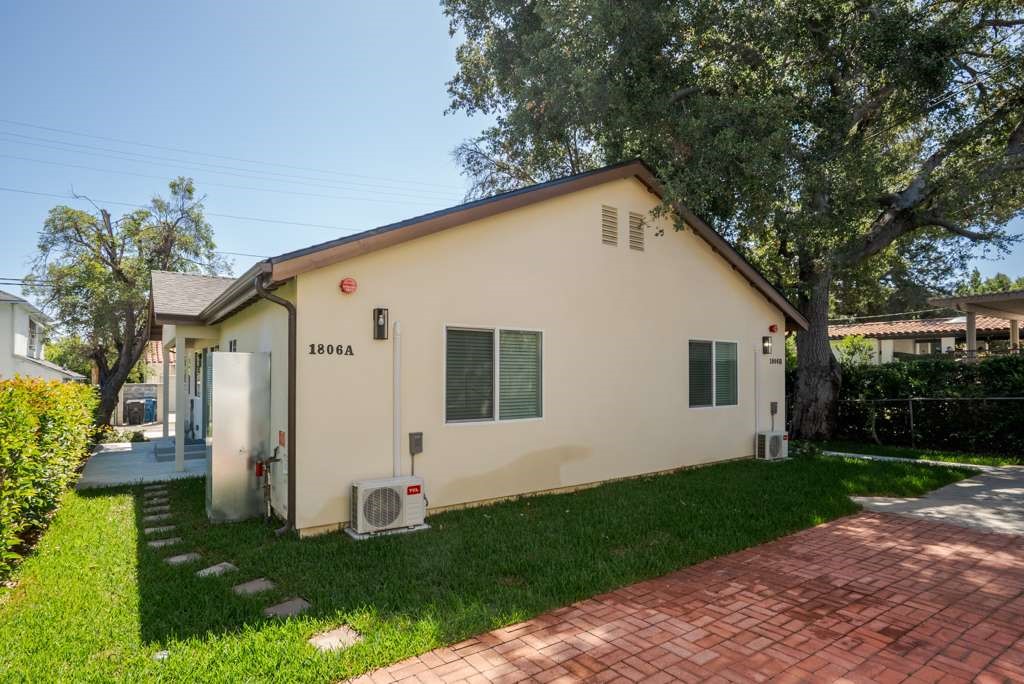 1806 South 8th Street, Unit B Alhambra, CA 91803 - Photo 12 of 44 a view of a white house with a yard