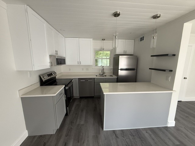 3304 Clawson Road, Unit B Austin, TX 78704 - Photo 2 of 12 A contemporary kitchen features bright cabinetry, stainless appliances, and sleek counter space.