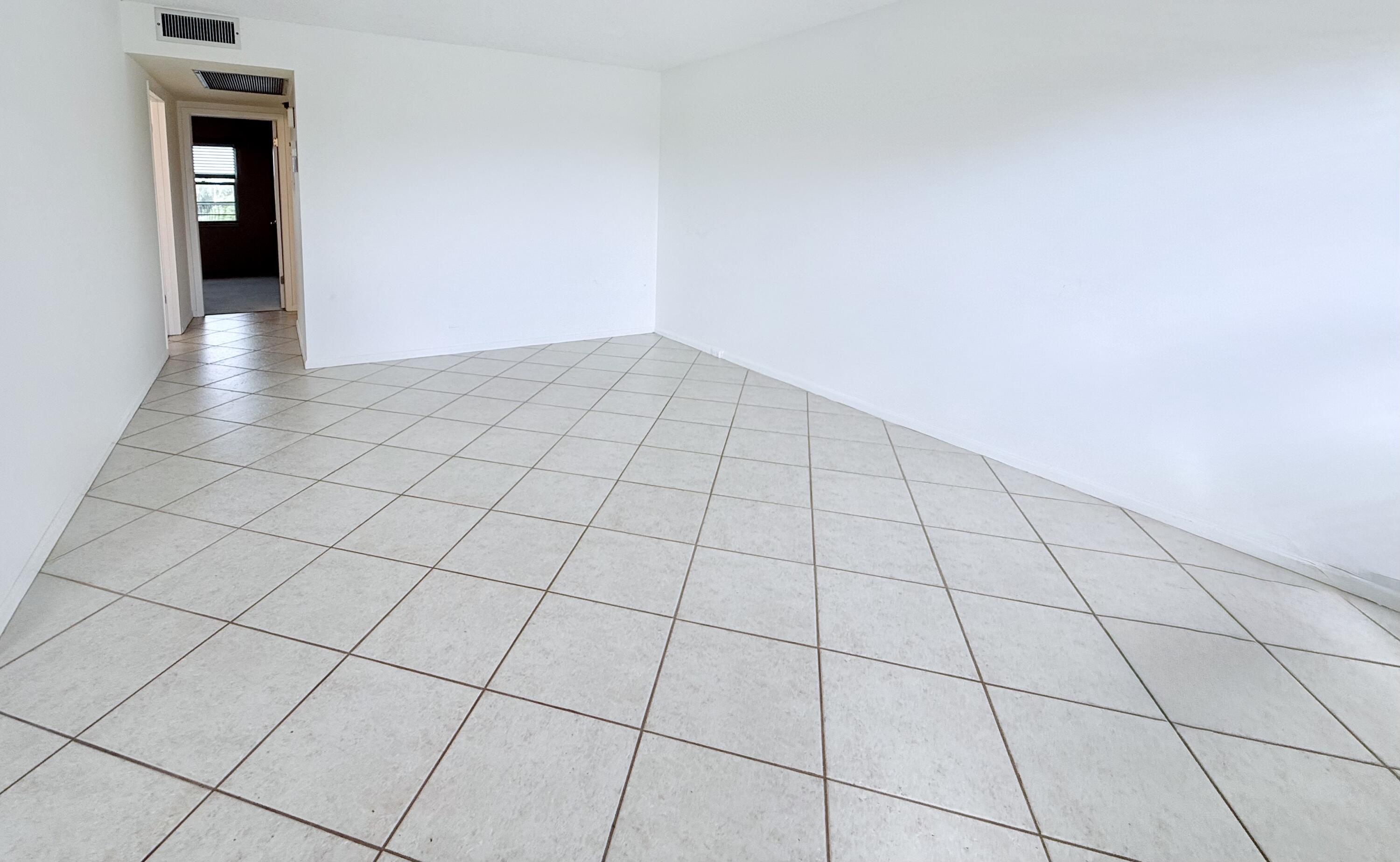a view of an empty room and closet area