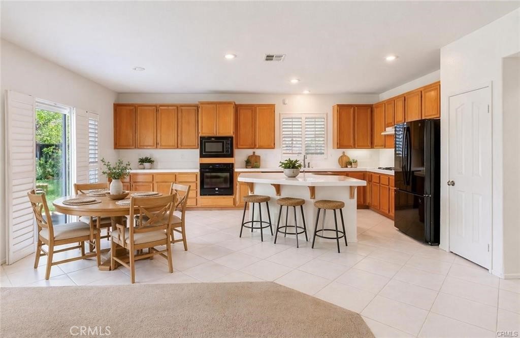 9140 Village Way Riverside, CA 92508 - Photo 11 of 37 AI-enhanced showing furniture island and table