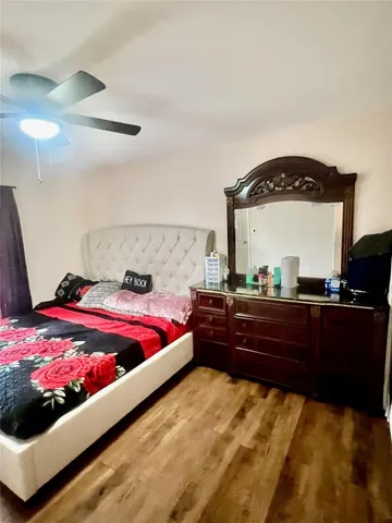 a bed room with a bed and dresser