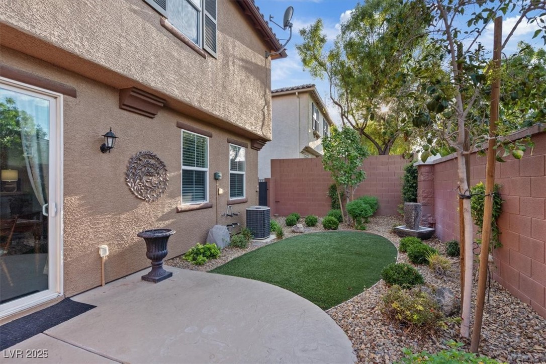 9116 Alpine Grove Avenue, Unit 103 Las Vegas, NV 89149 - Photo 24 of 30 Fenced backyard featuring a patio area
