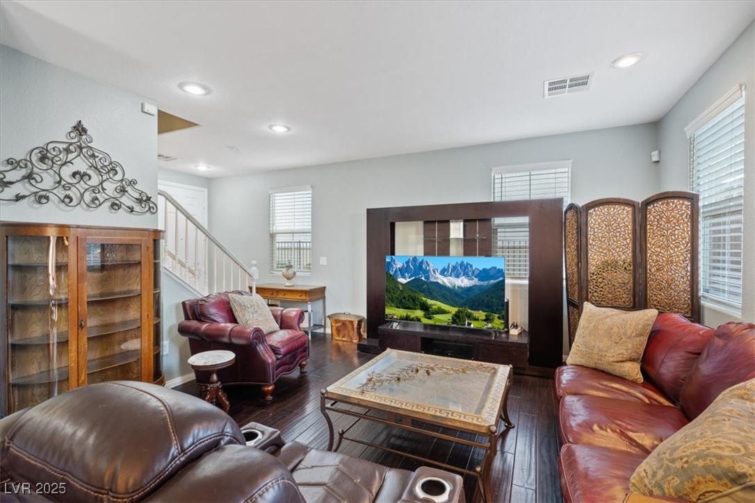 9116 Alpine Grove Avenue, Unit 103 Las Vegas, NV 89149 - Photo 7 of 30 Living room with dark wood finished floors, healthy amount of natural light, stairway, and recessed lighting