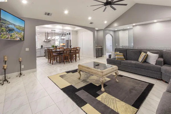 a living room with furniture and a rug