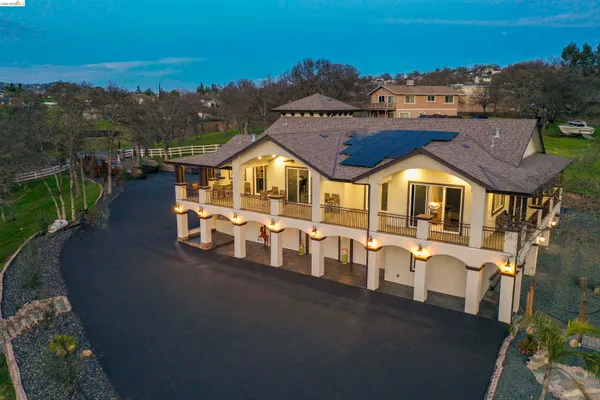 an aerial view of a house with a ocean view