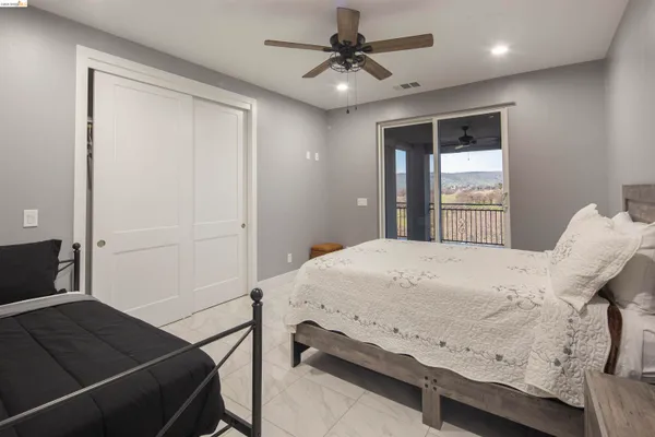 a bedroom with a bed and window