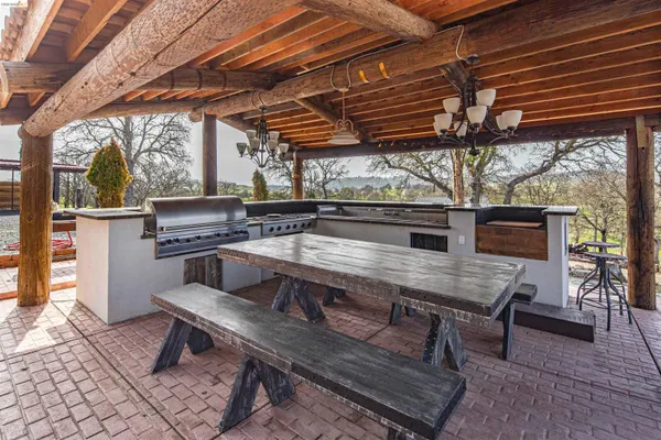 a view of a chairs and table in the patio