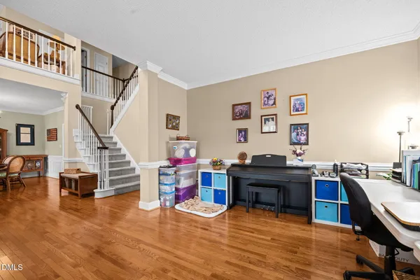 a view of a dining room with furniture and wooden floor