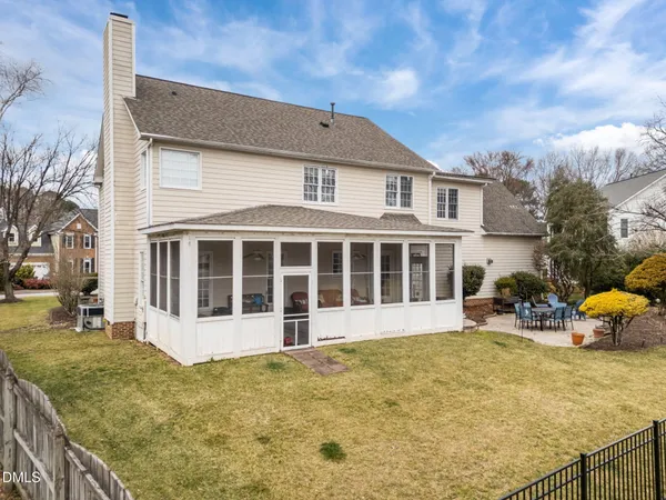 a front view of a house with large garden
