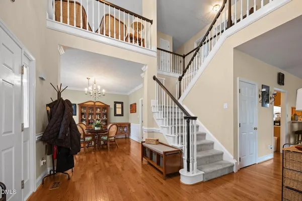 a view of entryway livingroom and hall with wooden floor