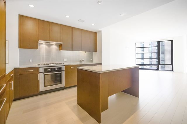 a kitchen with stainless steel appliances a stove and a refrigerator