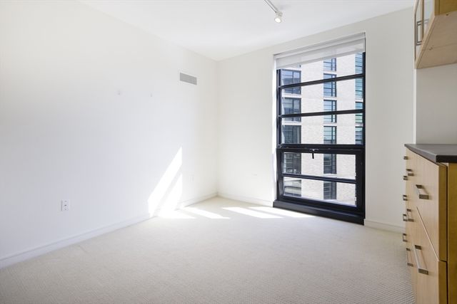 a view of a livingroom with shelves