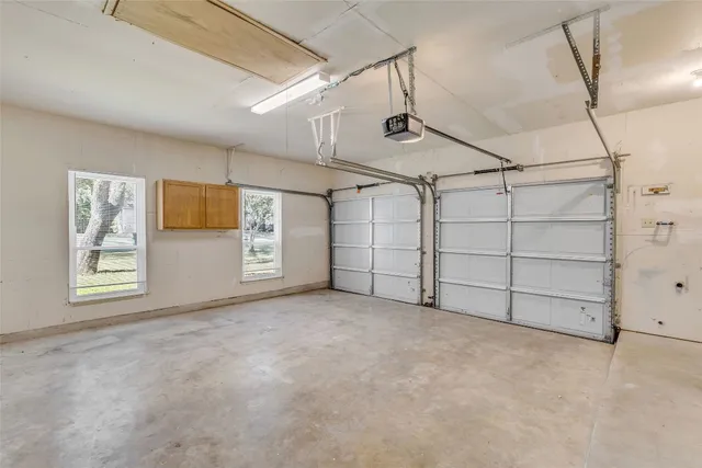 a view of a room with wooden floor and furniture