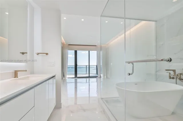 a bathroom with a bathtub and a sink