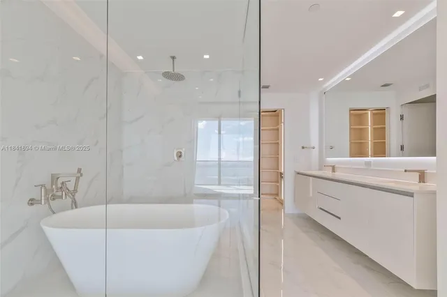 a bathroom with a bathtub and a sink