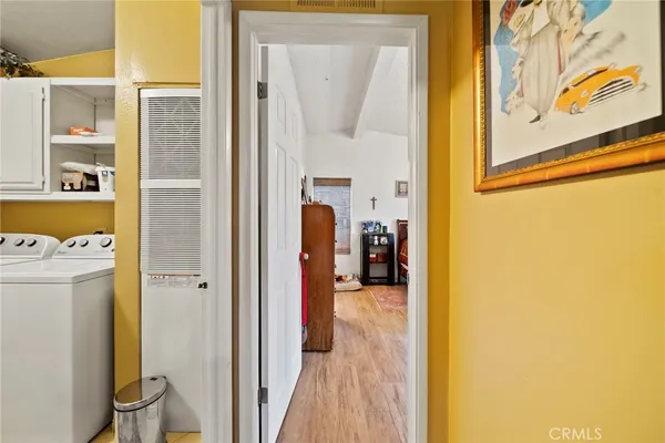 a view of a bedroom from a hallway
