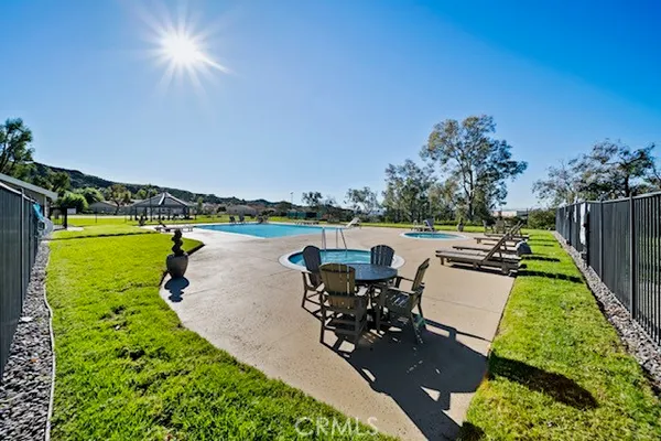 a view of a swimming pool with a patio