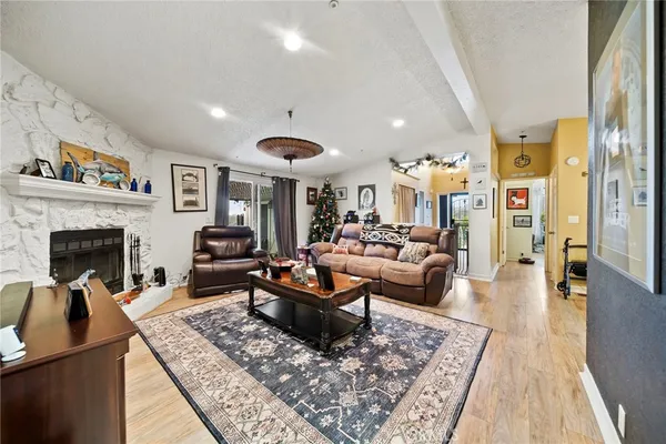 a living room with furniture and a fireplace