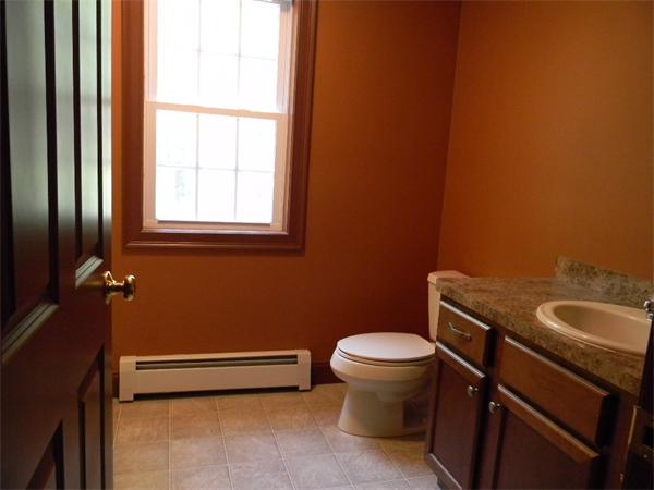 245 Tom Swamp Road Petersham, MA 01366 - Photo 5 of 14 a bathroom with a sink a toilet and window