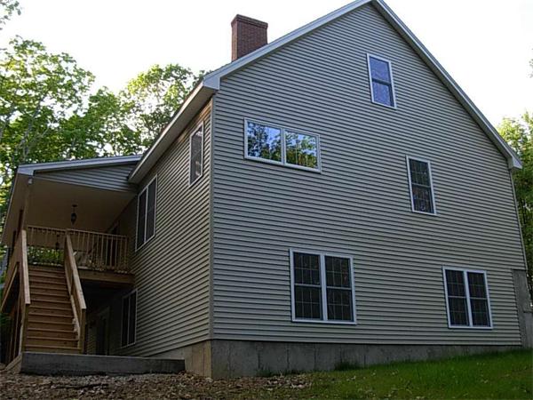 245 Tom Swamp Road Petersham, MA 01366 - Photo 9 of 14 a front view of a house with plants