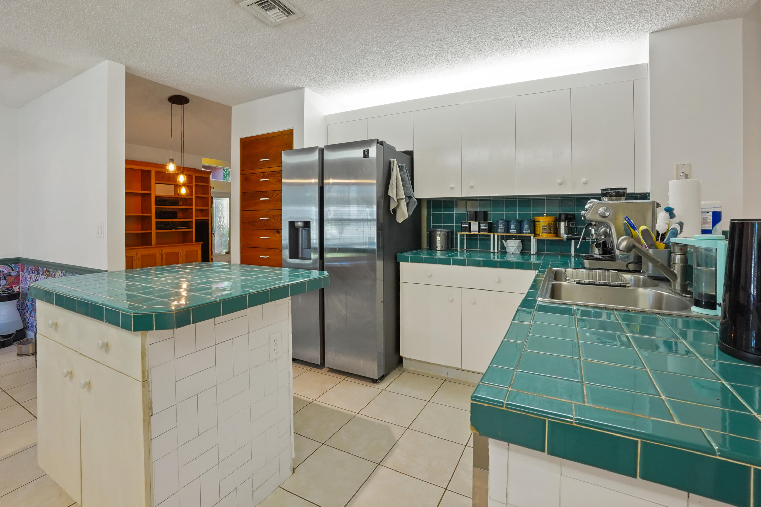 132 West Lee Road Delray Beach, FL 33445 - Photo 17 of 41 a kitchen with lots of counter top space and cabinets