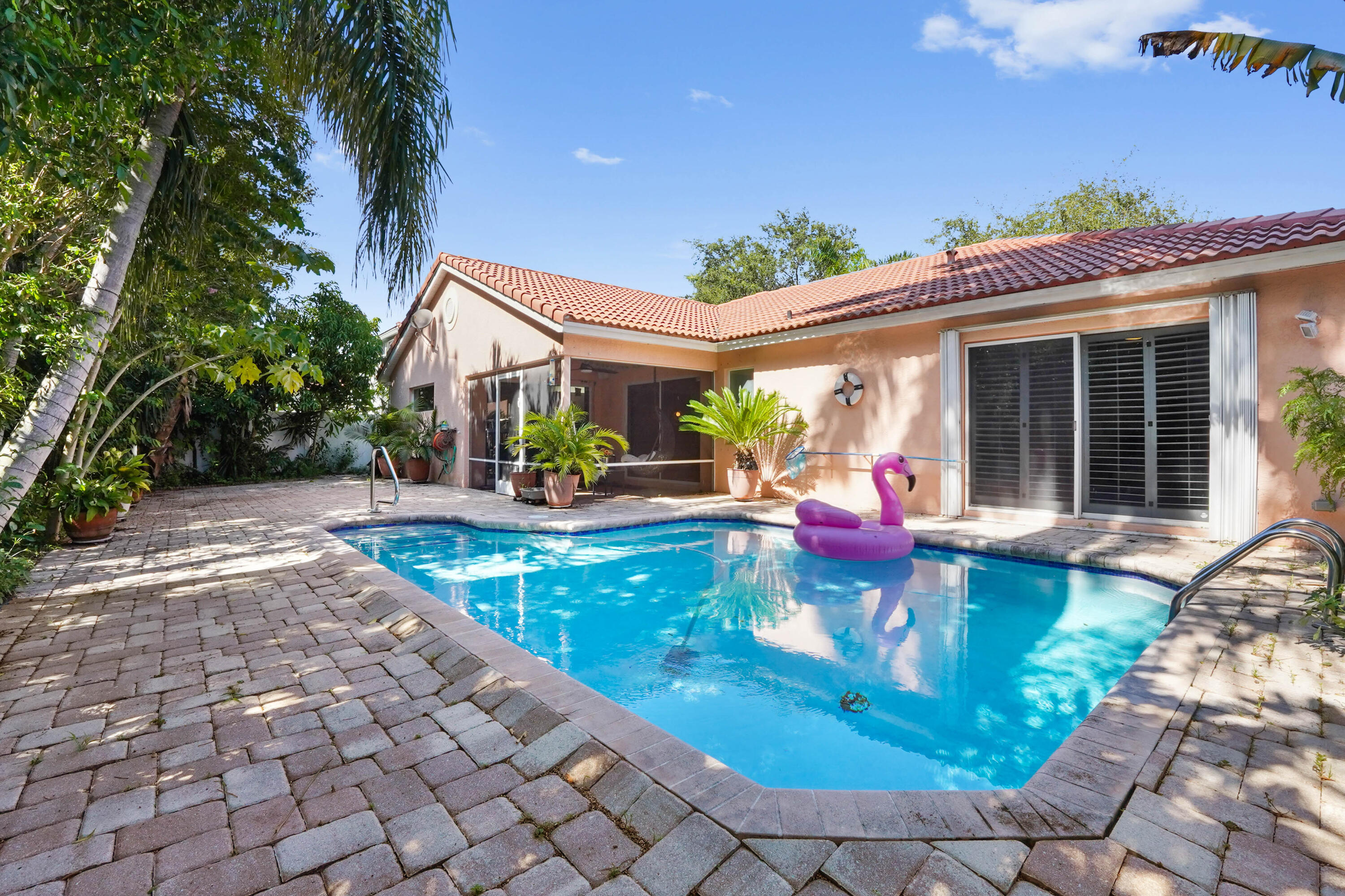 132 West Lee Road Delray Beach, FL 33445 - Photo 2 of 41 a view of a house with backyard porch and sitting area