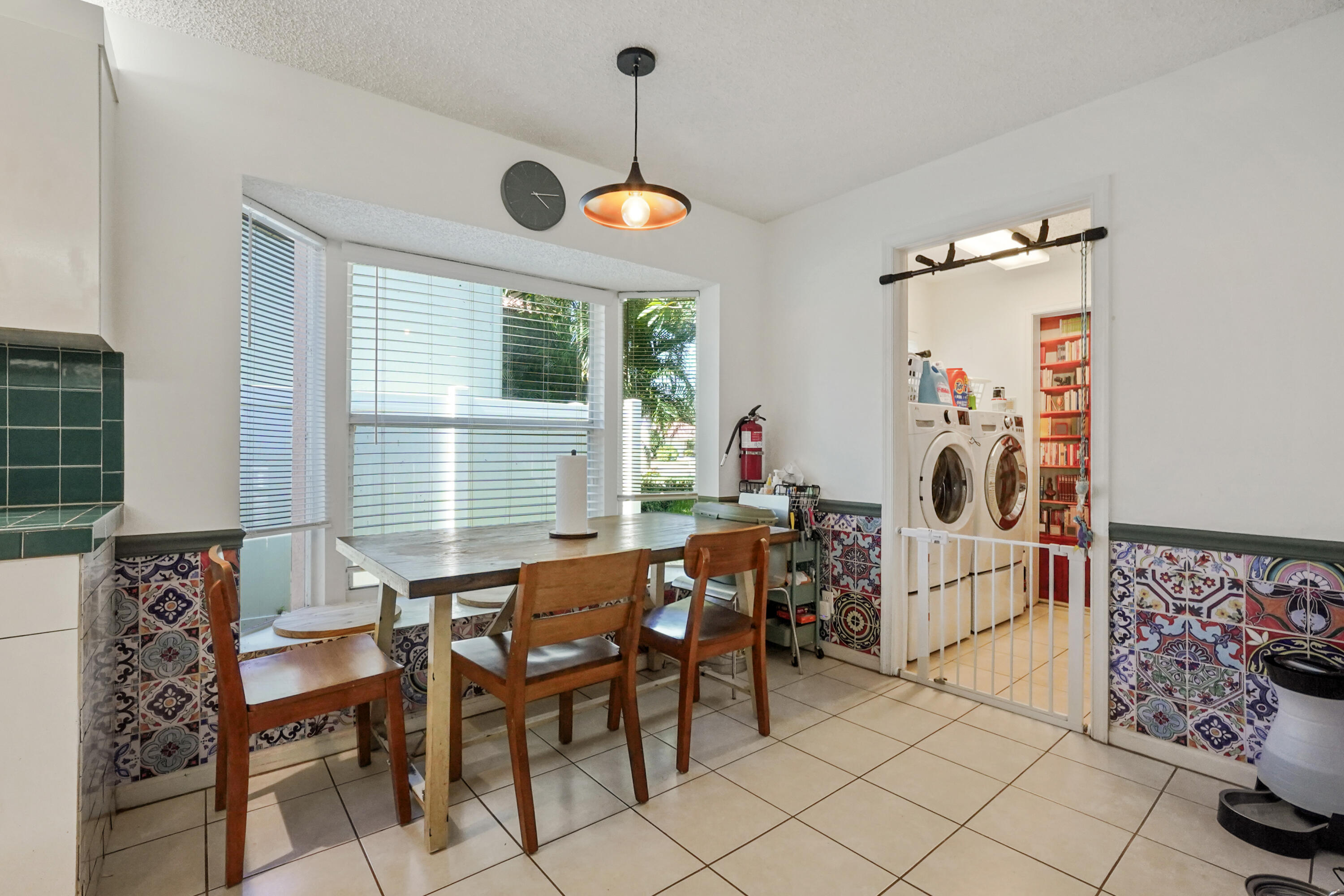 132 West Lee Road Delray Beach, FL 33445 - Photo 21 of 41 a view of a dining room with furniture window and outside view