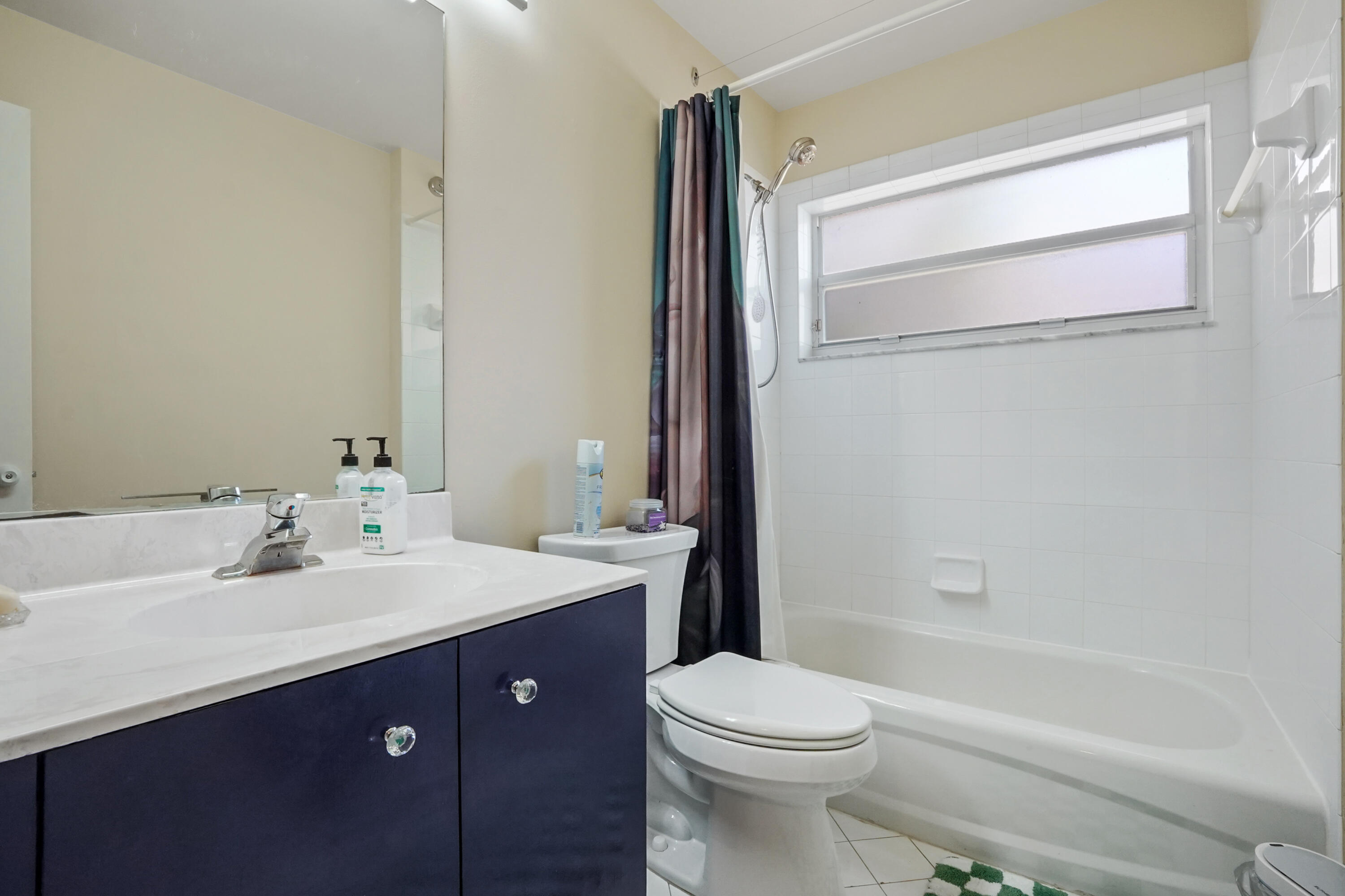 132 West Lee Road Delray Beach, FL 33445 - Photo 29 of 41 a bathroom with a sink a toilet and shower