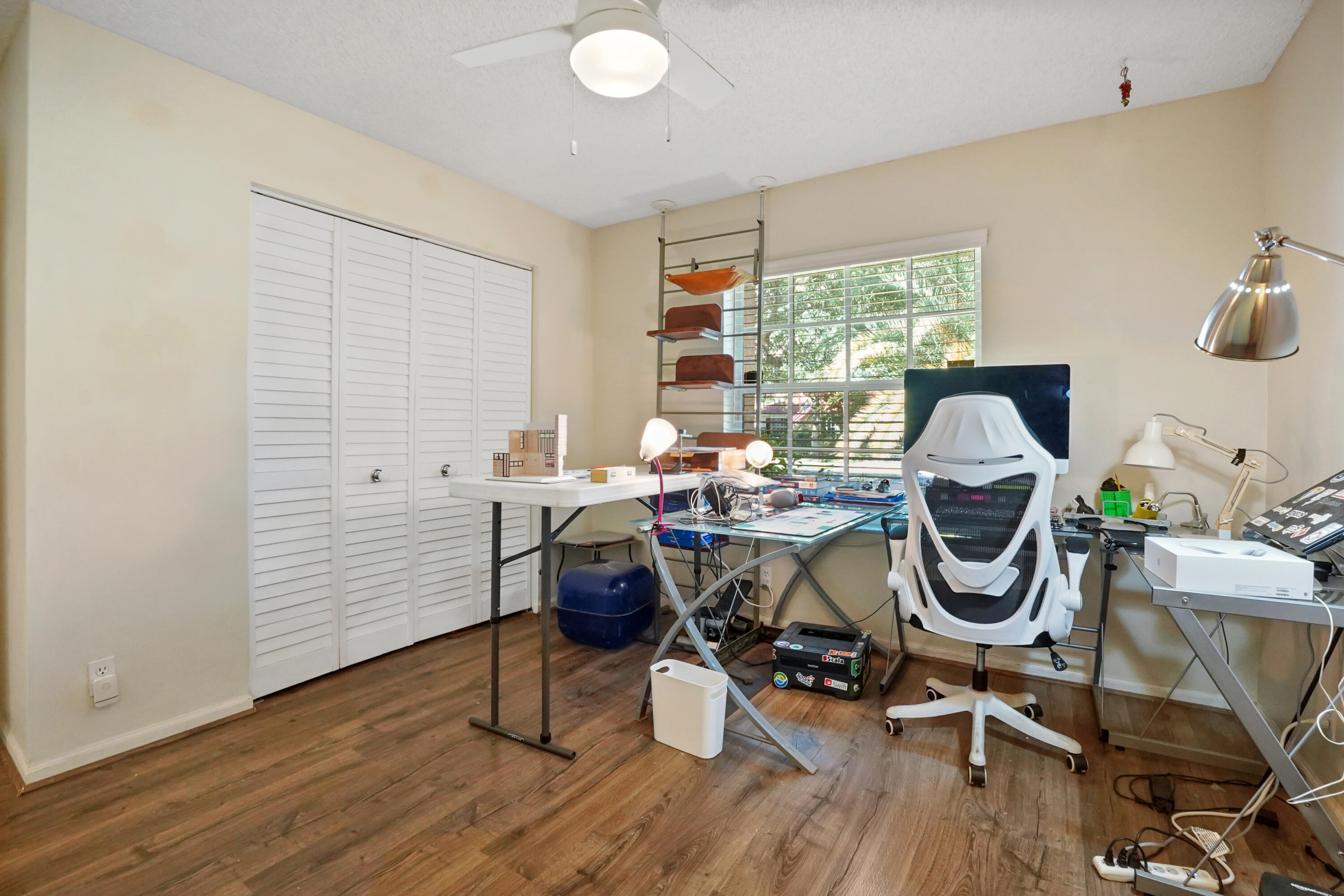 132 West Lee Road Delray Beach, FL 33445 - Photo 31 of 41 a view of a workspace with furniture and a window