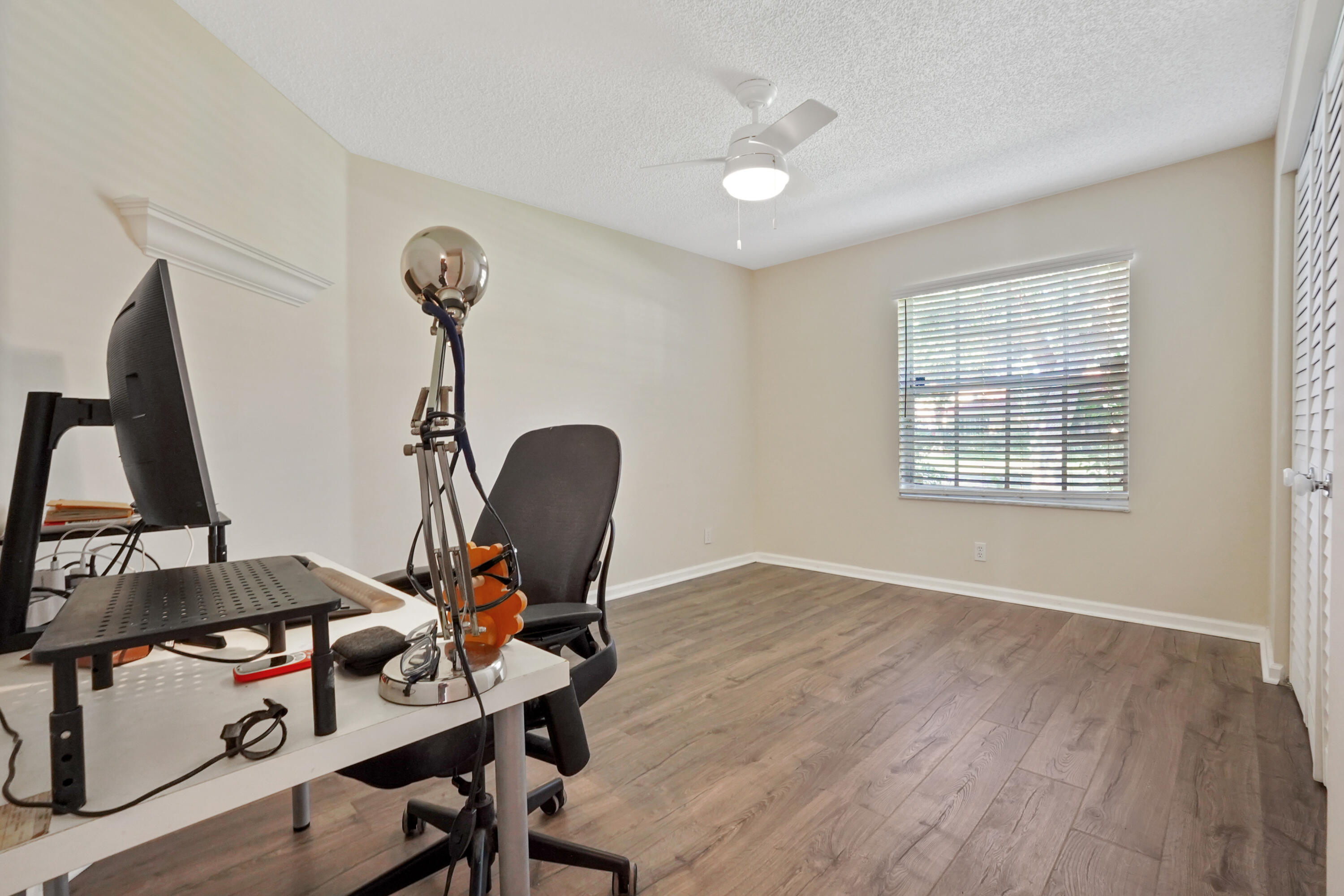 132 West Lee Road Delray Beach, FL 33445 - Photo 32 of 41 a view of workspace with wooden floor windows