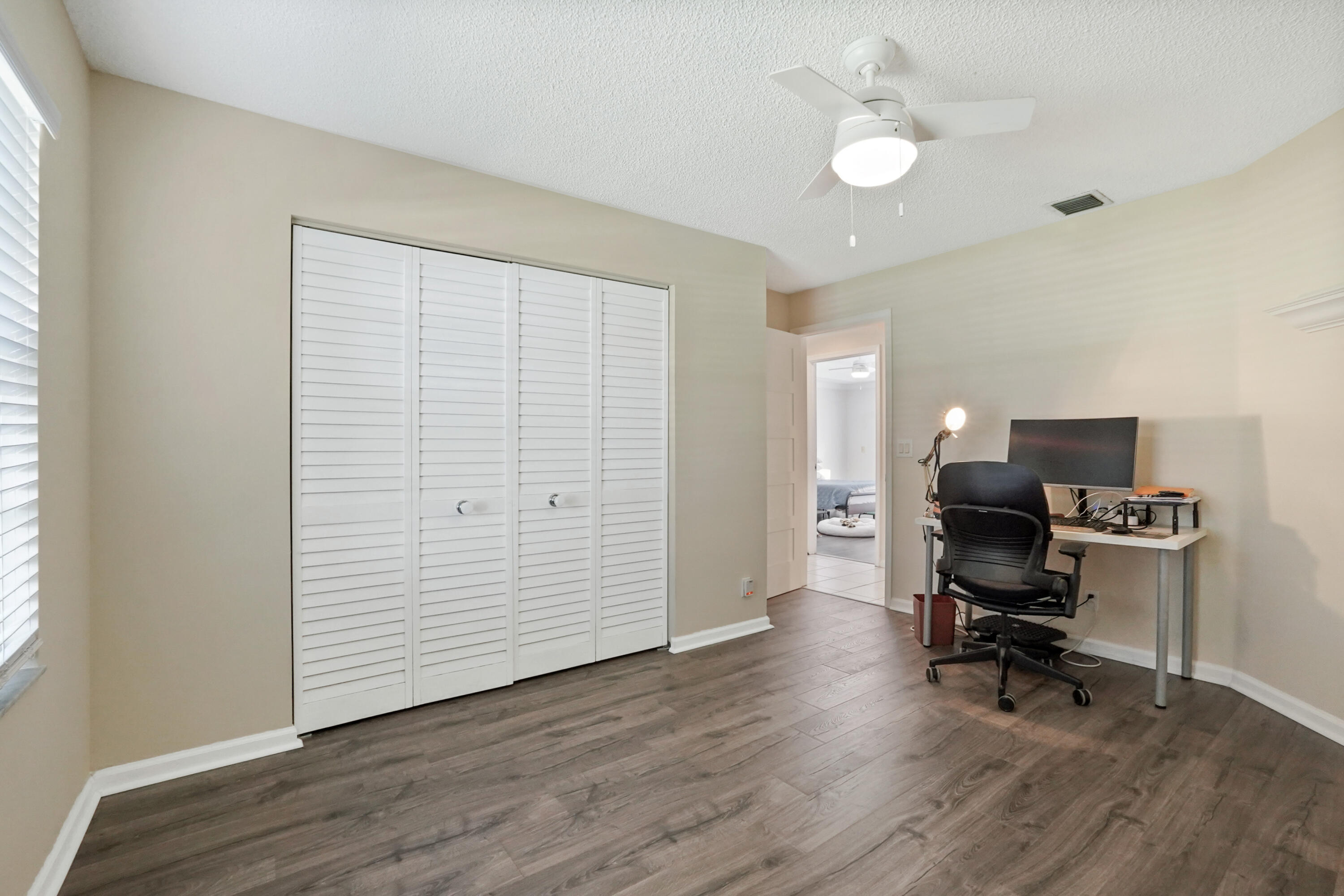 132 West Lee Road Delray Beach, FL 33445 - Photo 33 of 41 a workspace with wooden floor and a window