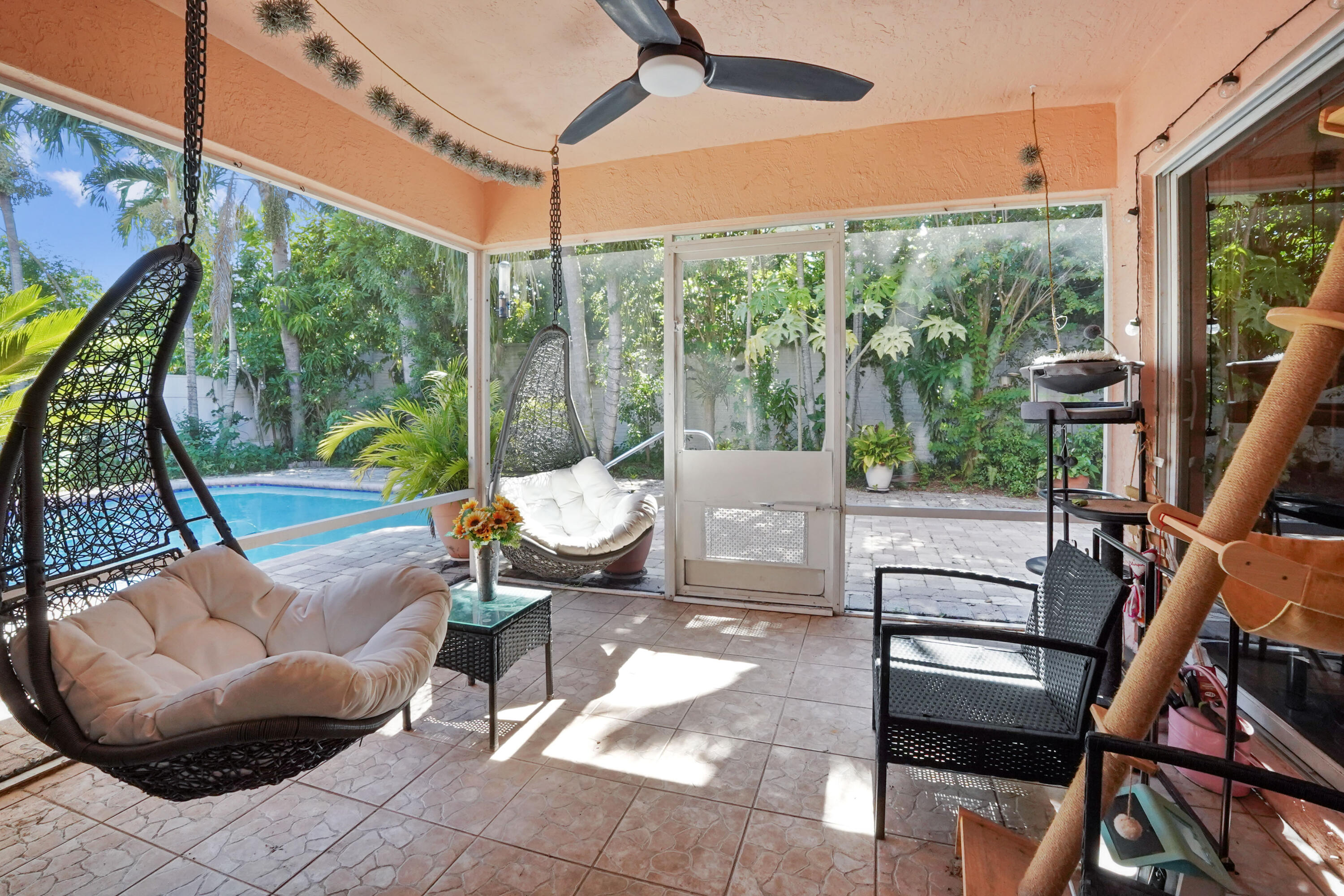 132 West Lee Road Delray Beach, FL 33445 - Photo 36 of 41 a living room filled with furniture and a floor to ceiling window