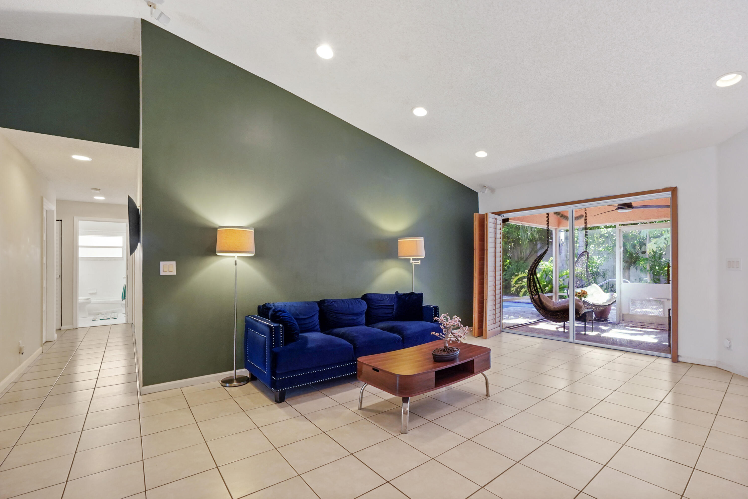 132 West Lee Road Delray Beach, FL 33445 - Photo 9 of 41 a living room with furniture and a large window